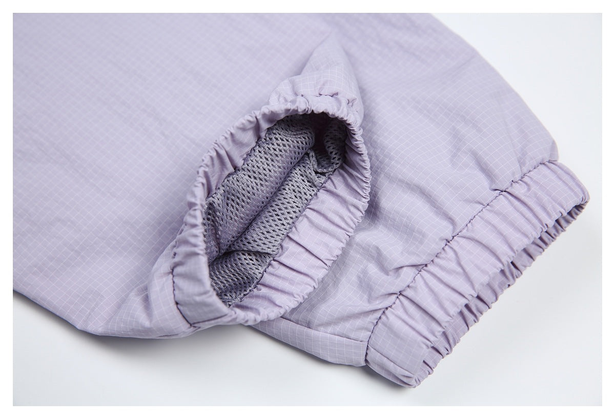Close-up of a lavender garment cuff with elastic edging and visible mesh lining.