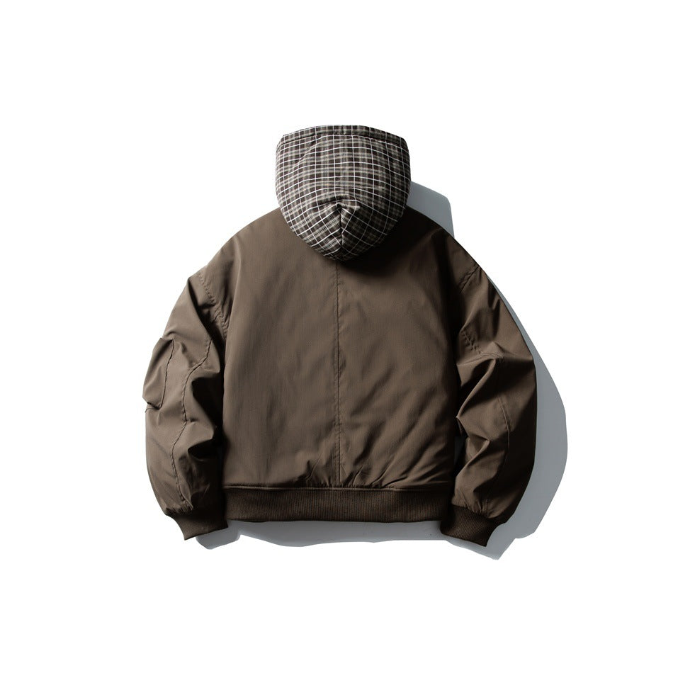 Back view of a dark brown jacket with a black-and-white plaid hood and ribbed cuffs and hem.