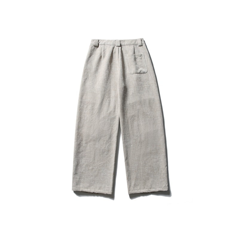Beige wide-leg corduroy-textured trousers, back flat lay showing a patch pocket and waistband belt loops