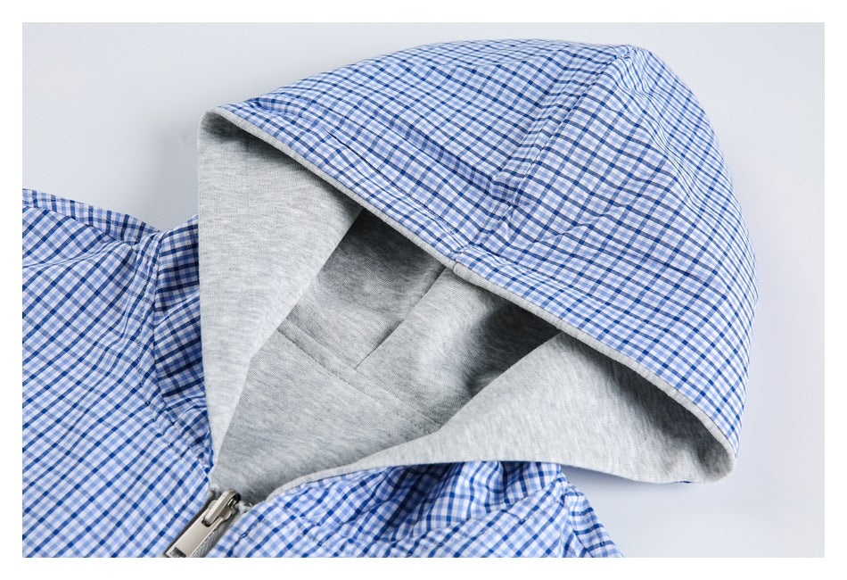 Open hood showing a gray interior and blue-and-white gingham outer fabric.