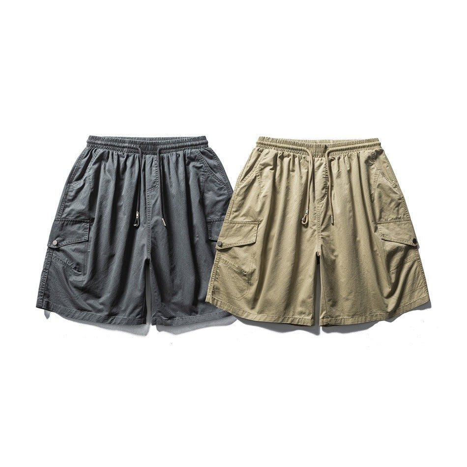 Front view of charcoal and khaki cargo shorts with elastic drawstring waists, side pockets, and flap pockets.