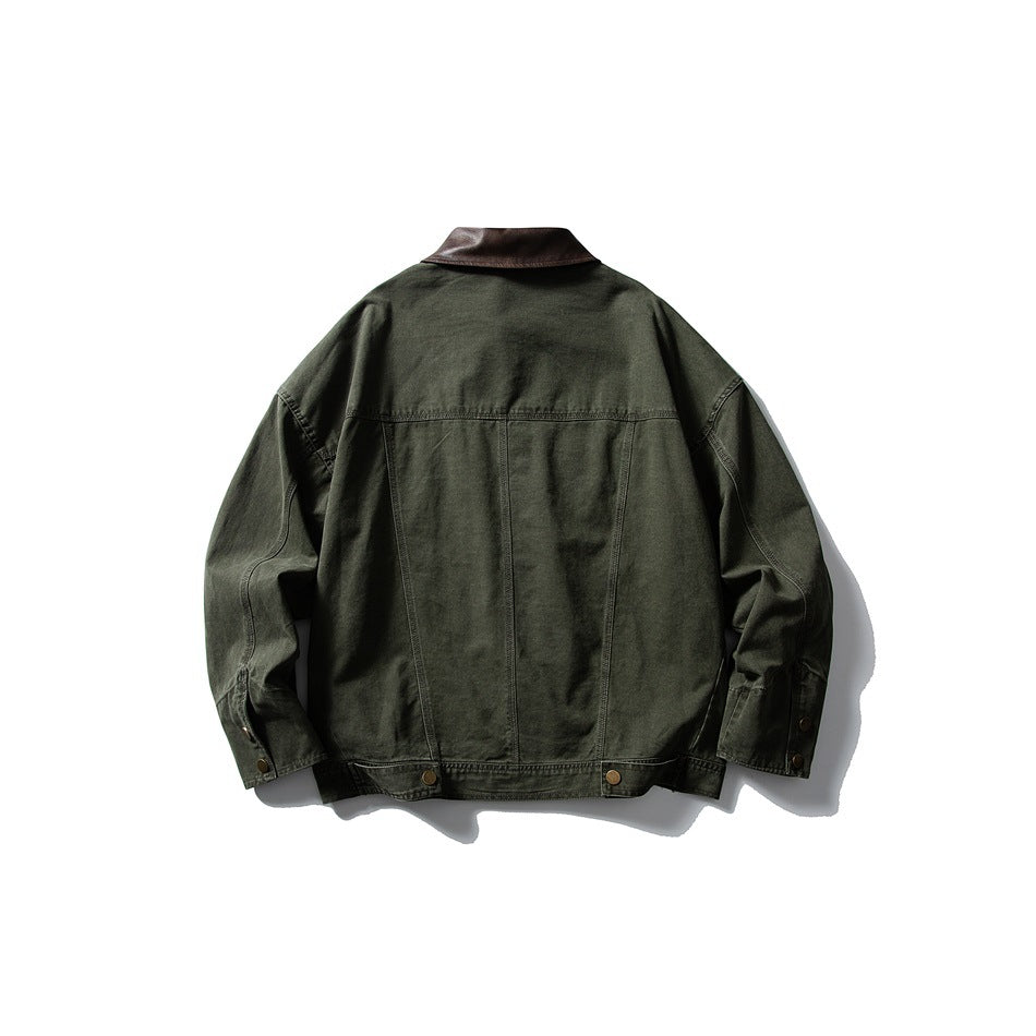 Back view of green jacket showing yoke seam, vertical panel seams, waist snap tabs and brown leather-look collar