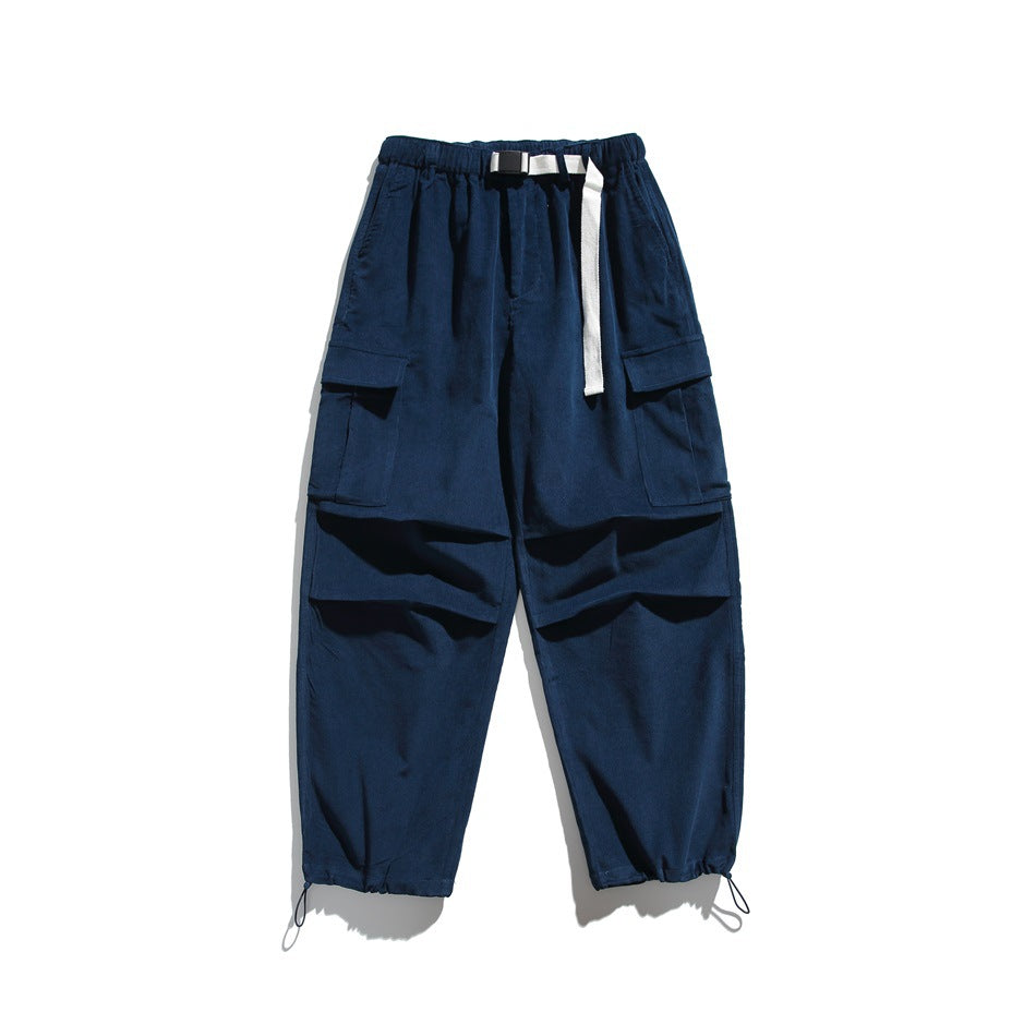 Deep blue corduroy-textured cargo pants flat lay with white belt, flap pockets and drawstring ankle hems