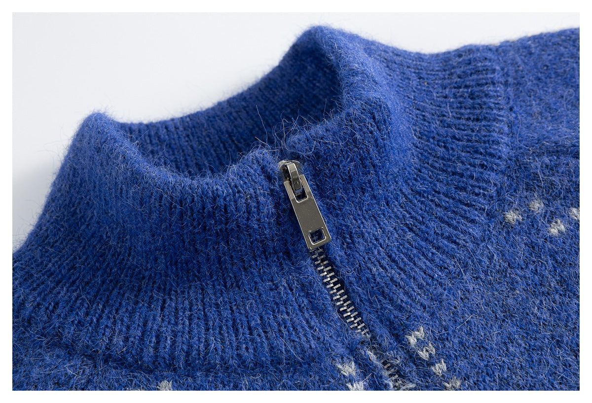 Close-up of the blue sweater's ribbed collar and metal zipper pull.