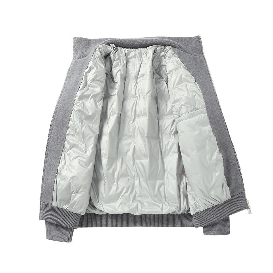 Gray jacket laid open flat showing the quilted light gray inner layer, ribbed hem and cuffs, and zipper edge