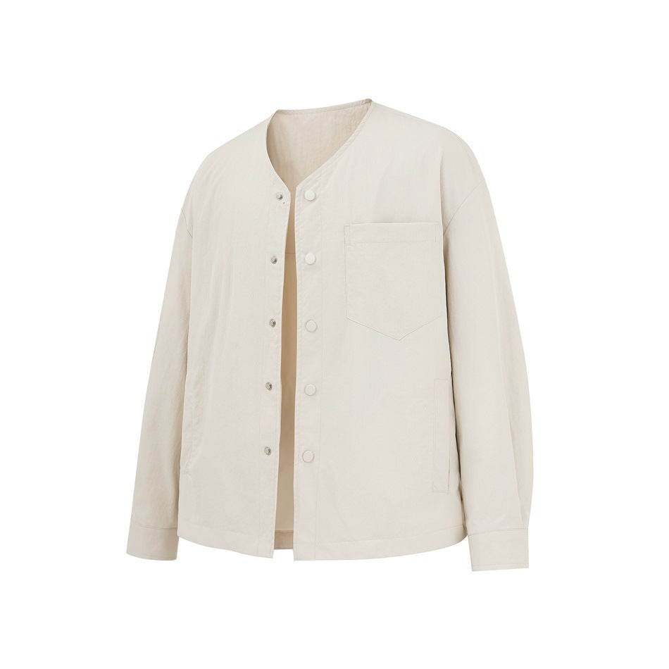 Beige collarless button-front jacket in angled view with open front, chest pocket and side pockets