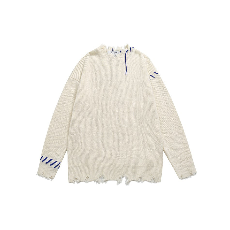 Cream knit crew-neck sweater with frayed edges and blue contrast stitching, flat front view