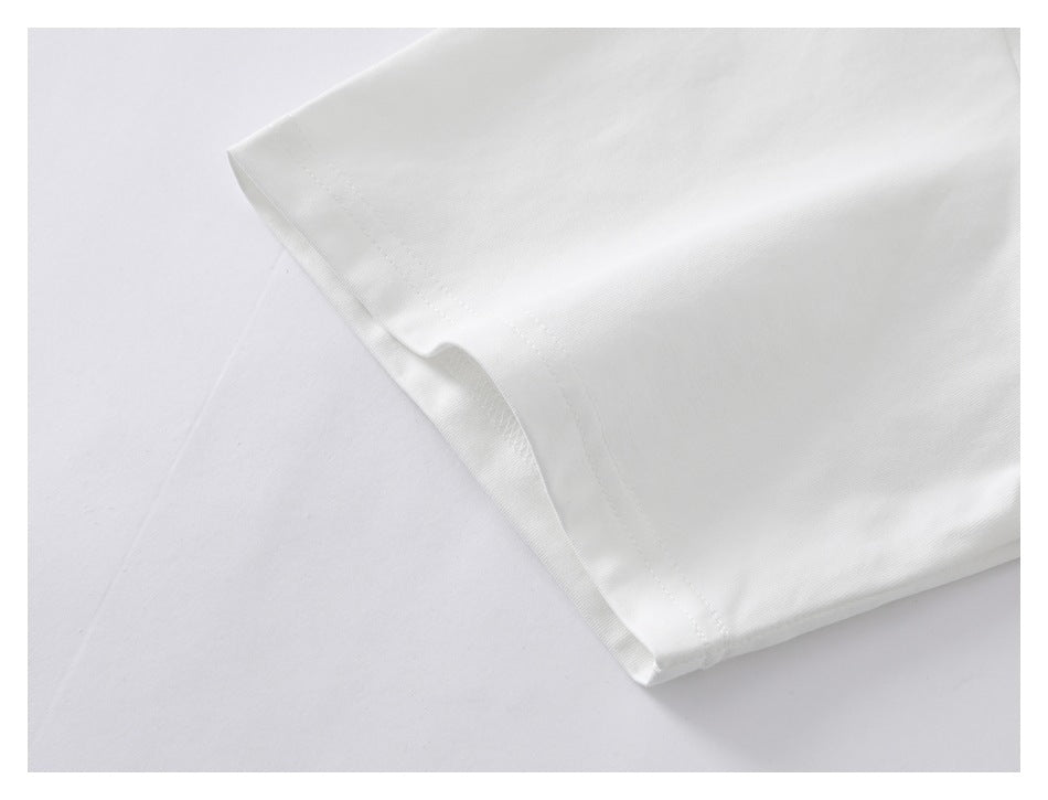 Close-up of a white garment sleeve edge with neat double-row stitching.