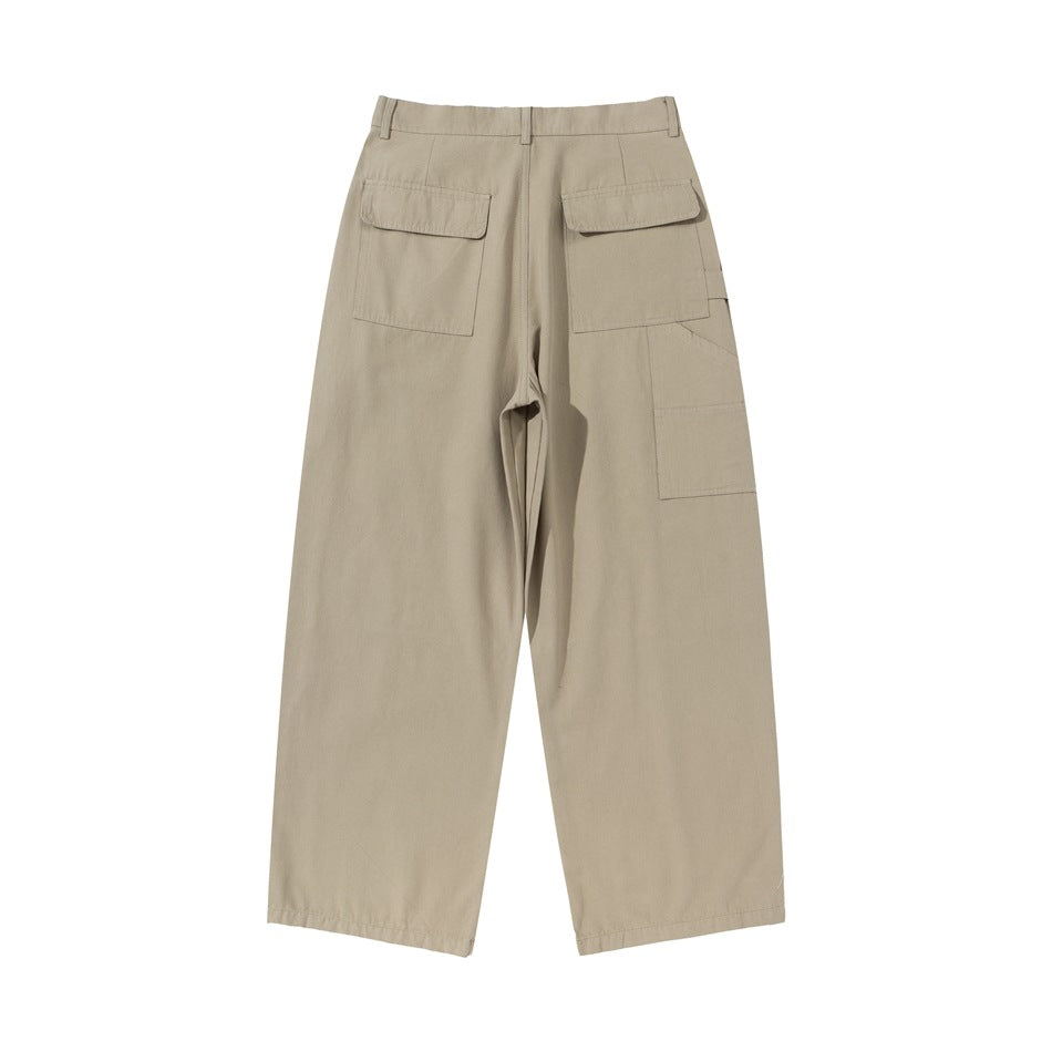 Back view of khaki wide-leg pants with two flap pockets and a patch pocket on the outer thigh