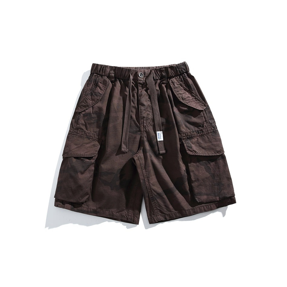 Dark brown-purple camouflage cargo shorts with drawstring waist and large flap pockets, front view