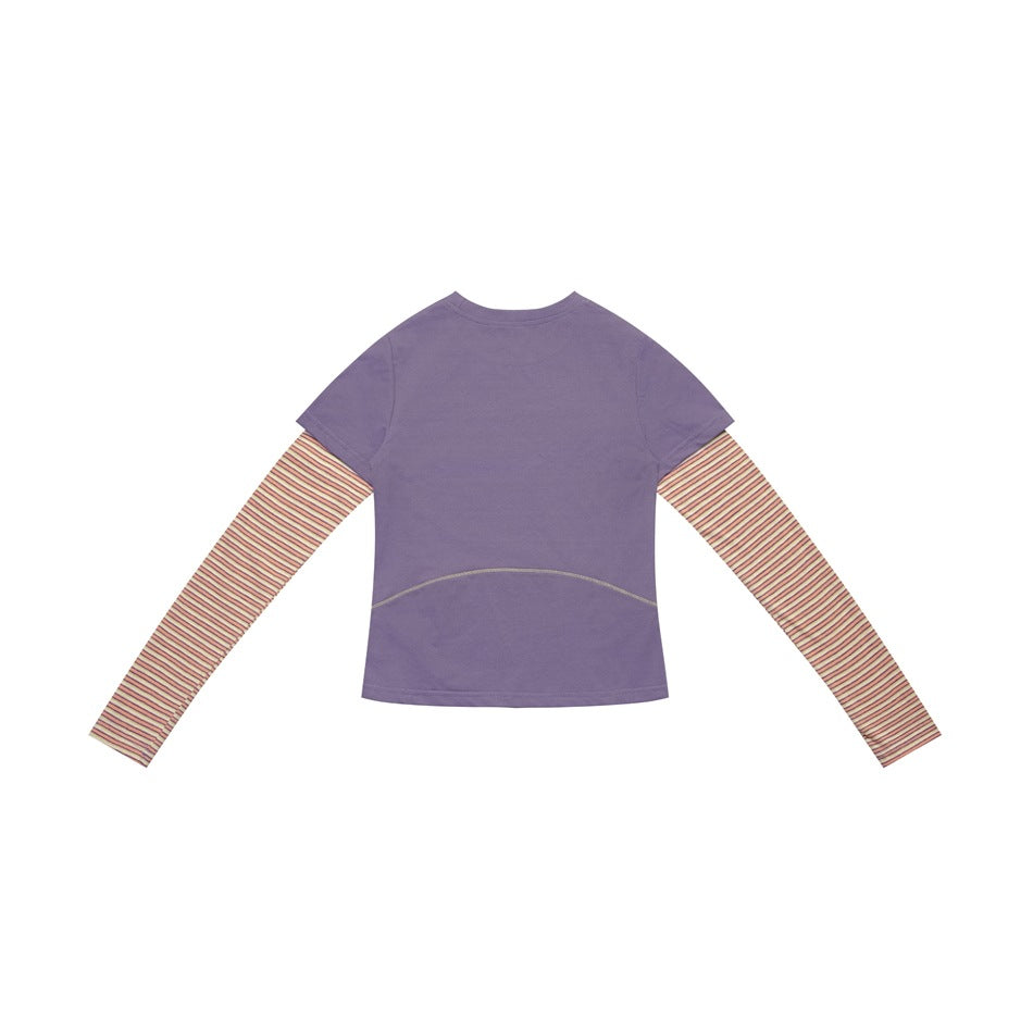 Back view of a purple short-sleeve top layered over long sleeves with narrow multicolor stripes.