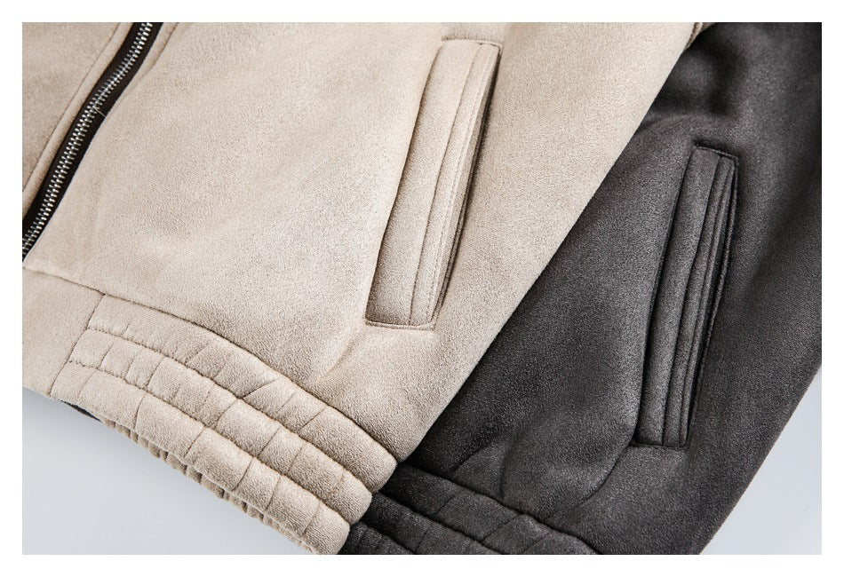 Close-up of taupe and charcoal jacket pockets and gathered hems.