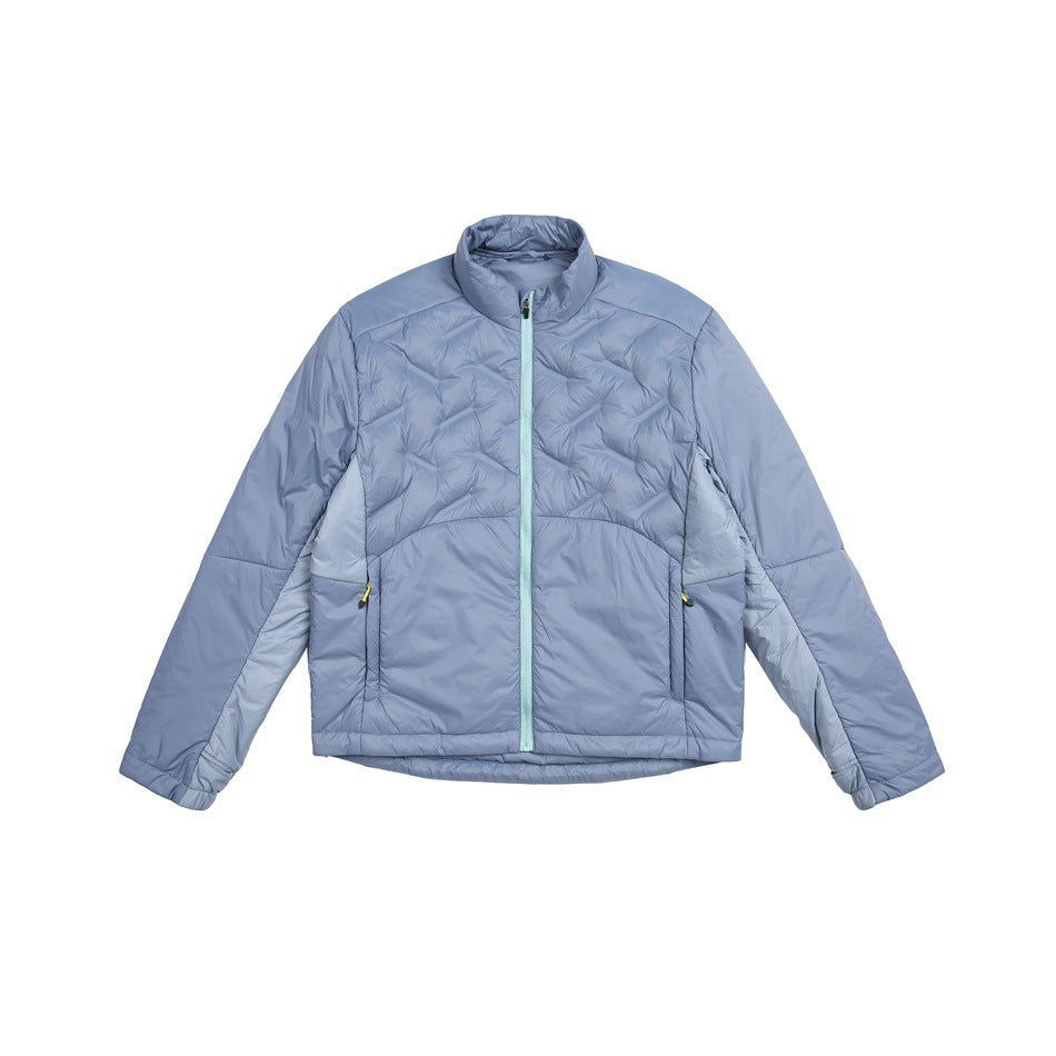Blue quilted stand-collar zip jacket with lighter blue side panels and a mint zipper, flat lay front view