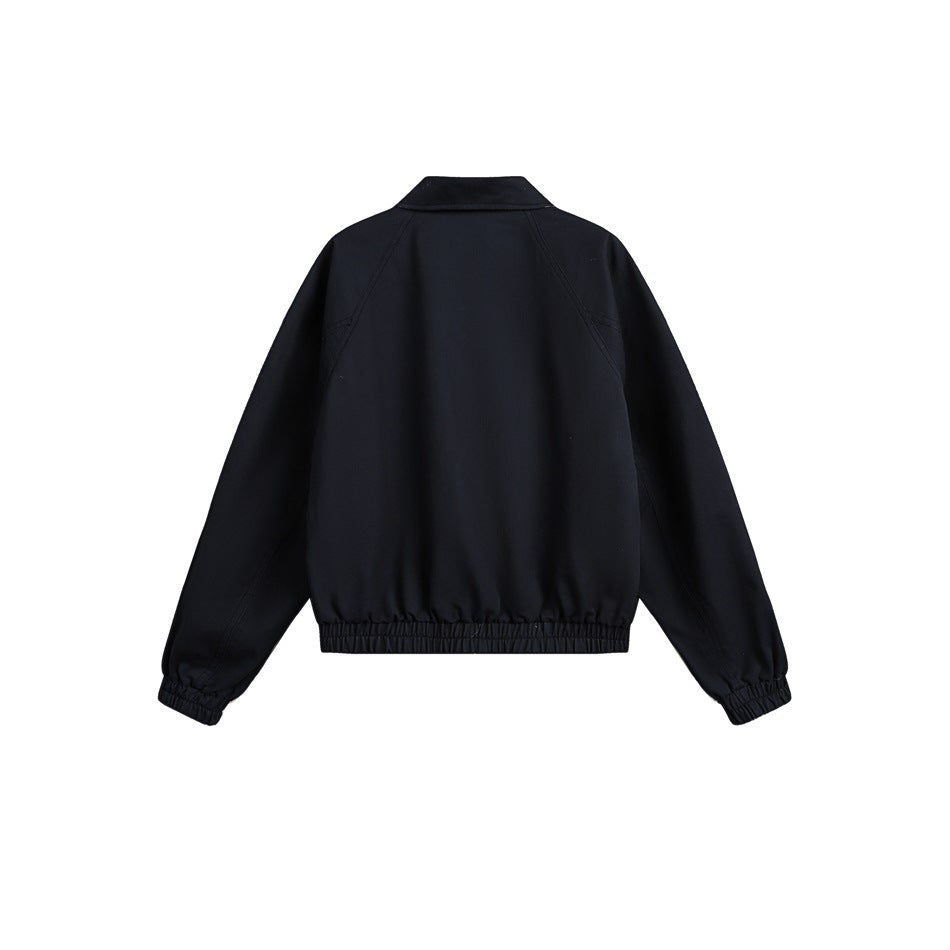 Back view of a dark navy jacket with a plain body, pointed collar, raglan seams, and gathered cuffs and hem.