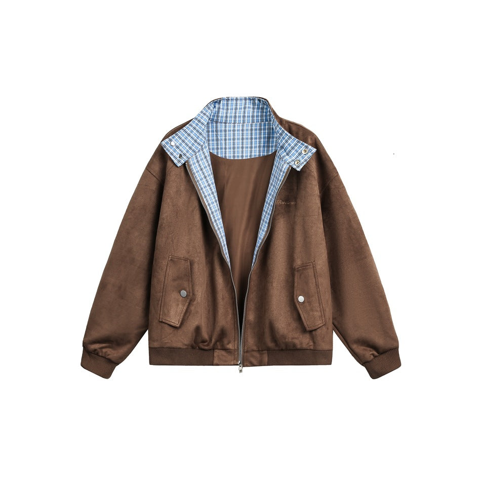 Brown zip-front jacket with a blue plaid inner collar, snap-tab details, and two front pockets.