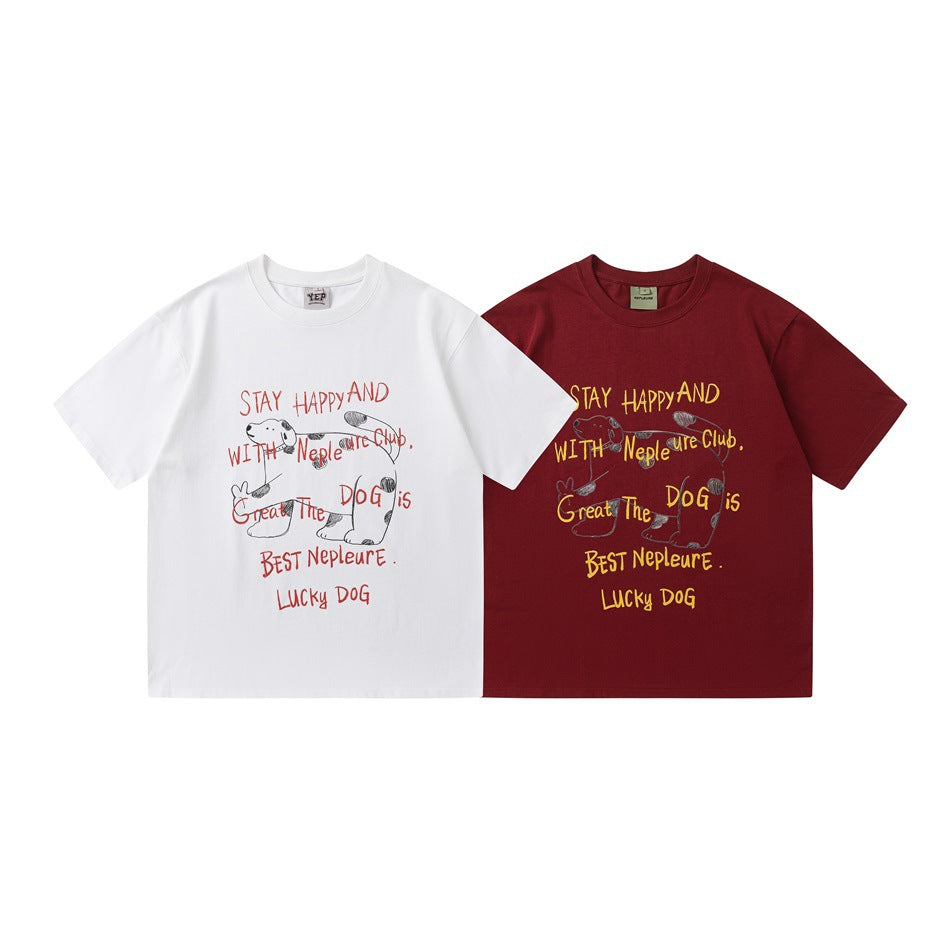 Front views of the graphic T-shirt in white and burgundy, both with a dog illustration and yellow or red lettering.