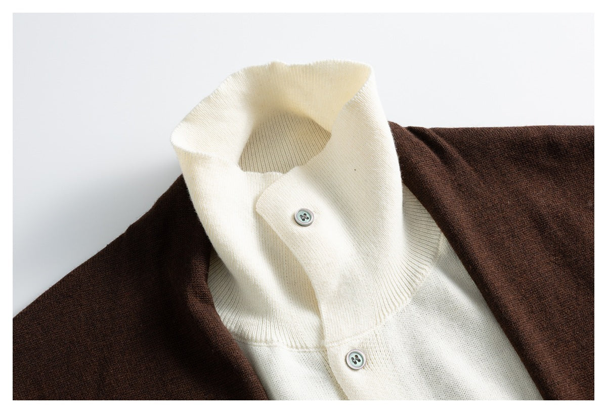 Close-up of the cream ribbed high collar, button, and dark brown cardigan shoulder.
