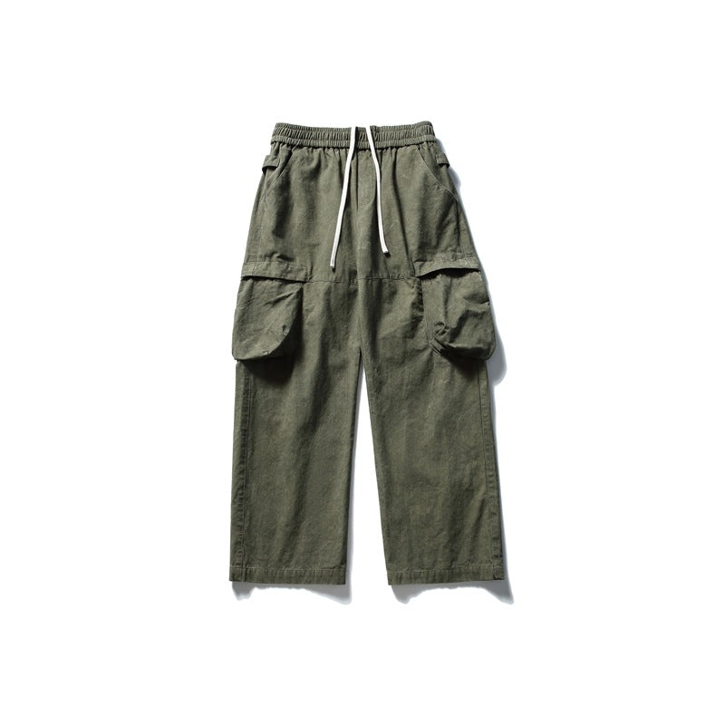 Green wide-leg cargo pants with elastic drawstring waist and large flap side pockets, flat lay front view