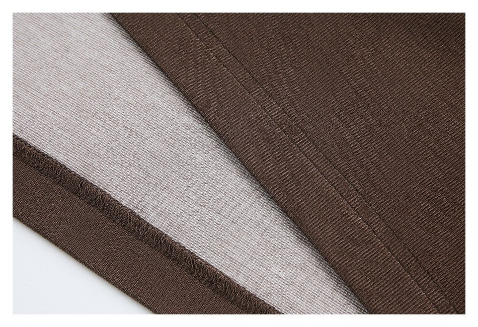 Close-up of brown rib-knit fabric showing an inside seam and stitched edge.