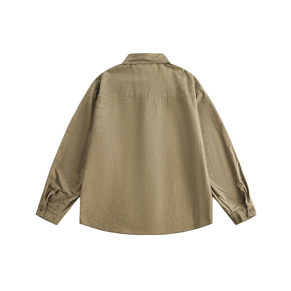 Back view of a khaki-brown long-sleeve collared shirt with a yoke seam and buttoned cuffs, laid flat on white.