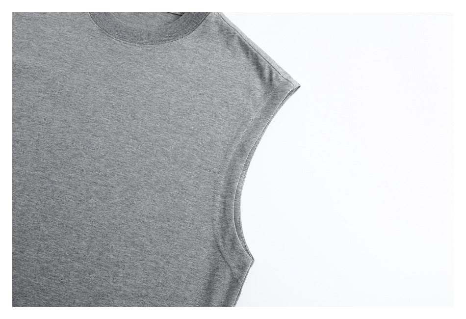 Close-up of the gray top's wide armhole binding and side seam.