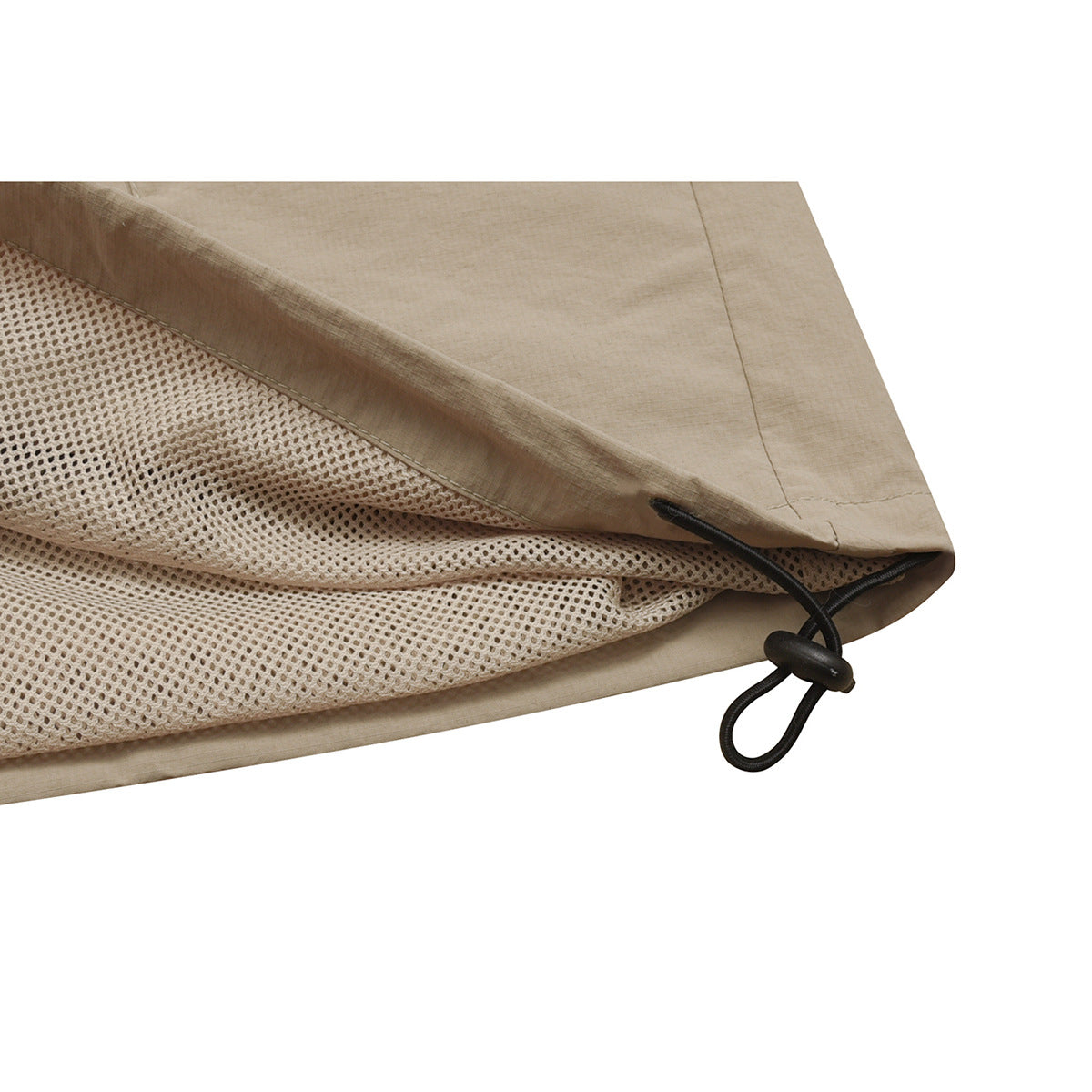 Close-up of a beige jacket hem showing mesh lining and an adjustable elastic cord.
