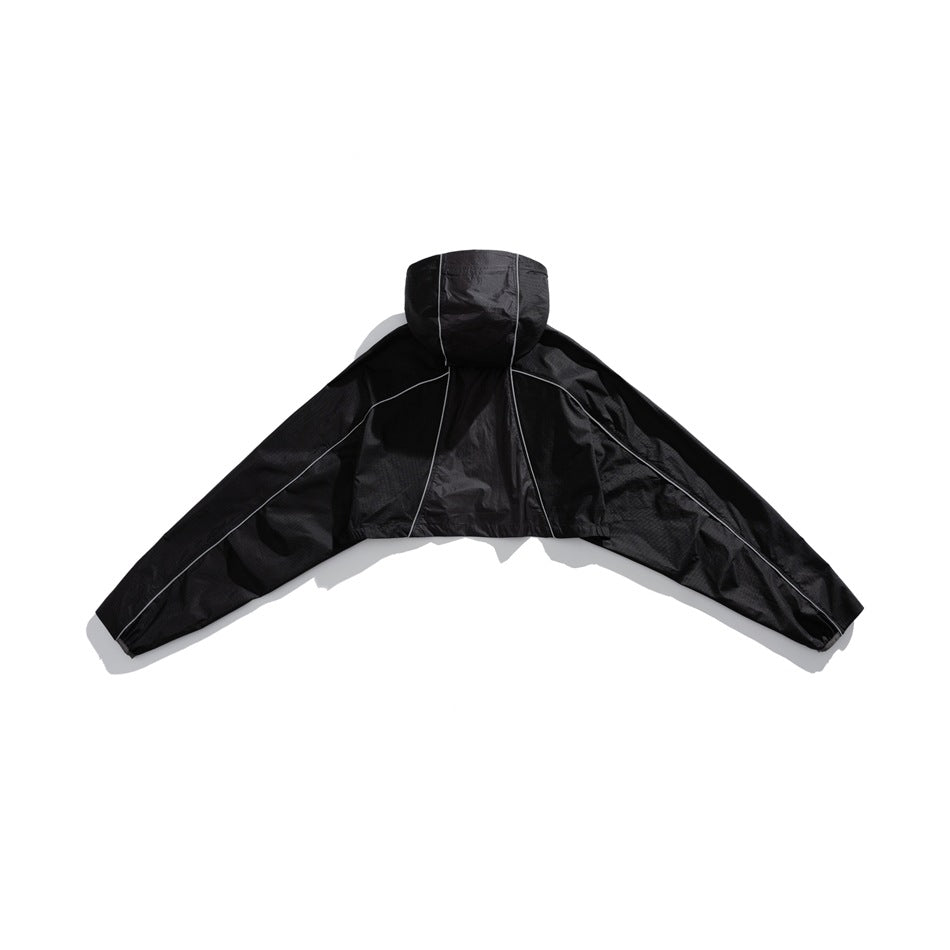 Back view of a black hooded cropped jacket with wide sleeves and reflective piping.