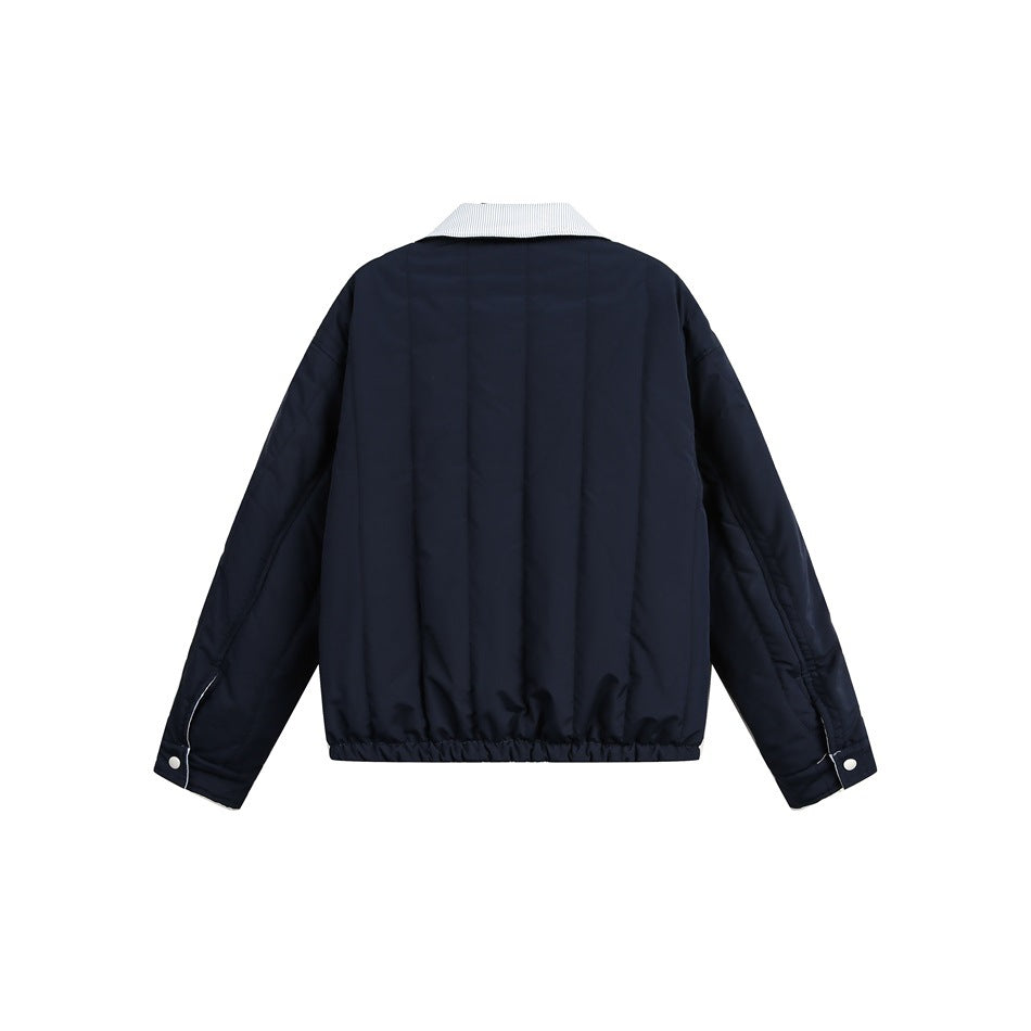 Back view of a navy jacket with a white pinstriped collar, long sleeves, snap cuffs and an elasticated hem.