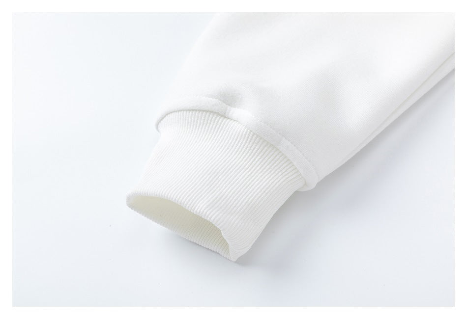 Close-up of a white sleeve ending in a ribbed cuff.