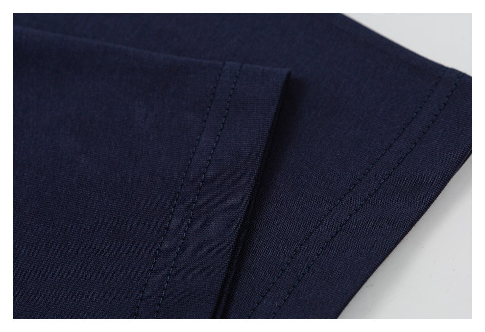 Close-up of a navy shirt seam and double-stitched hem.