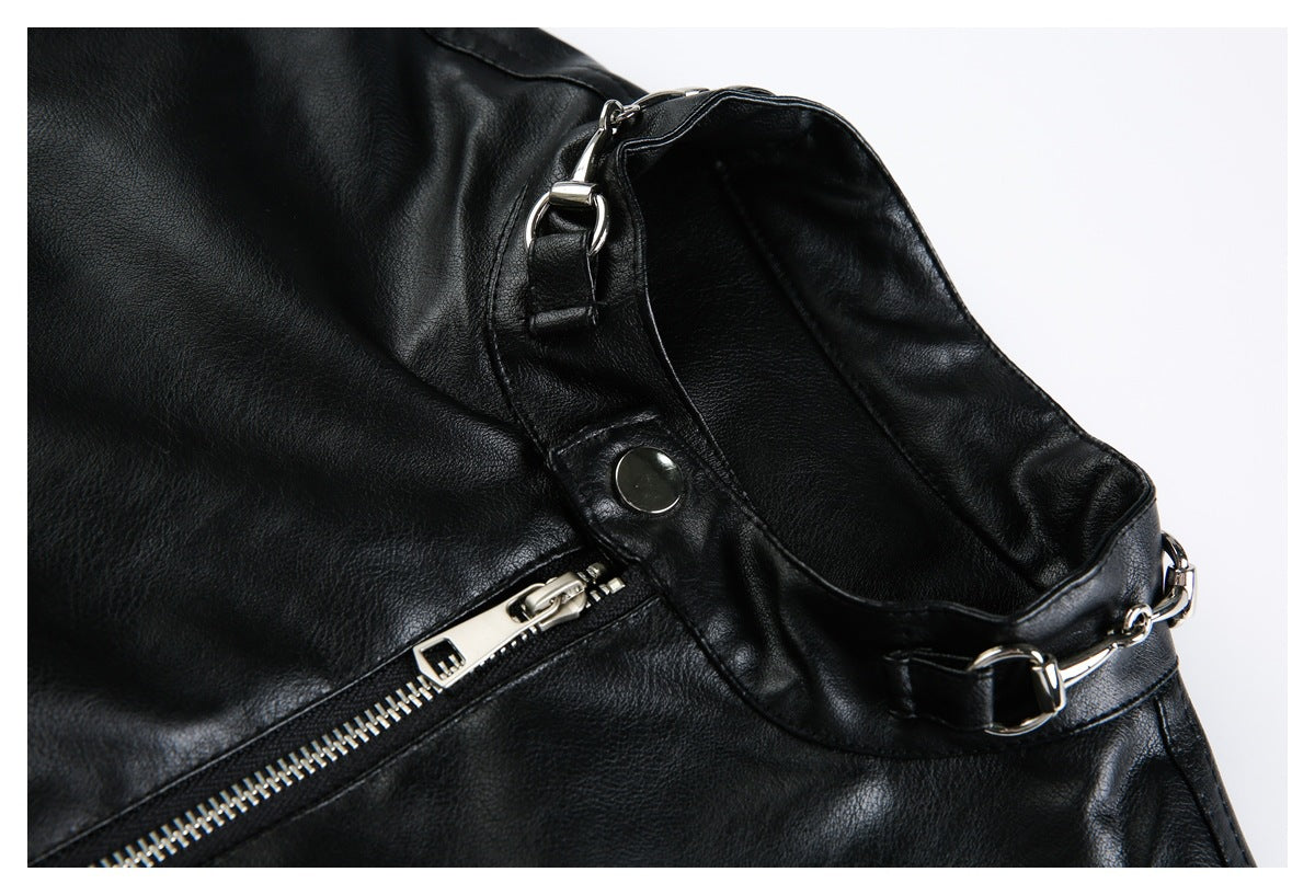 Close-up of the black jacket's collar, silver hardware, snap tab, and diagonal zipper.