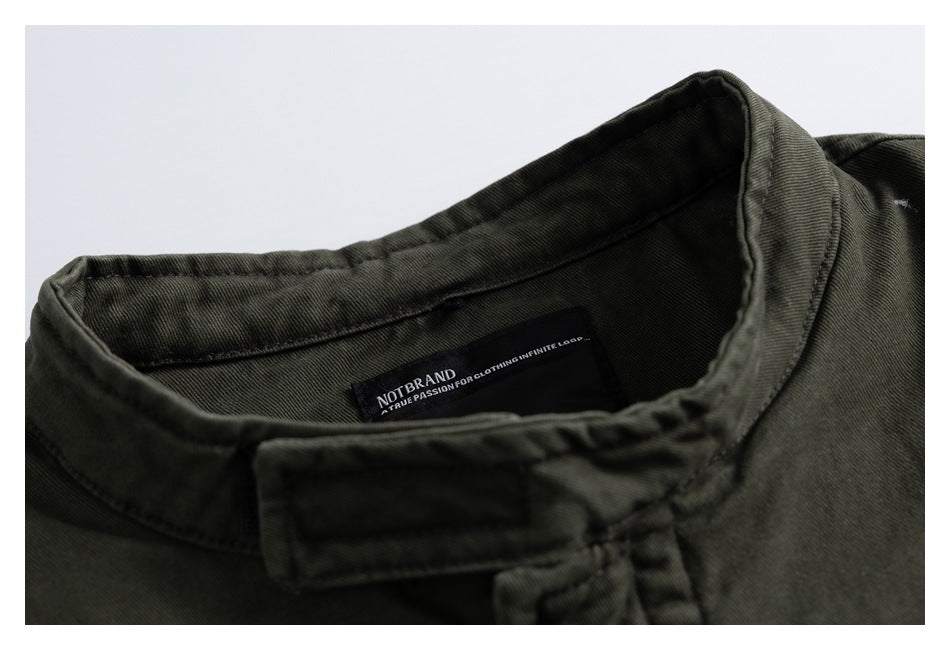 Close-up of an olive-gray jacket collar and sewn-in black neck label.