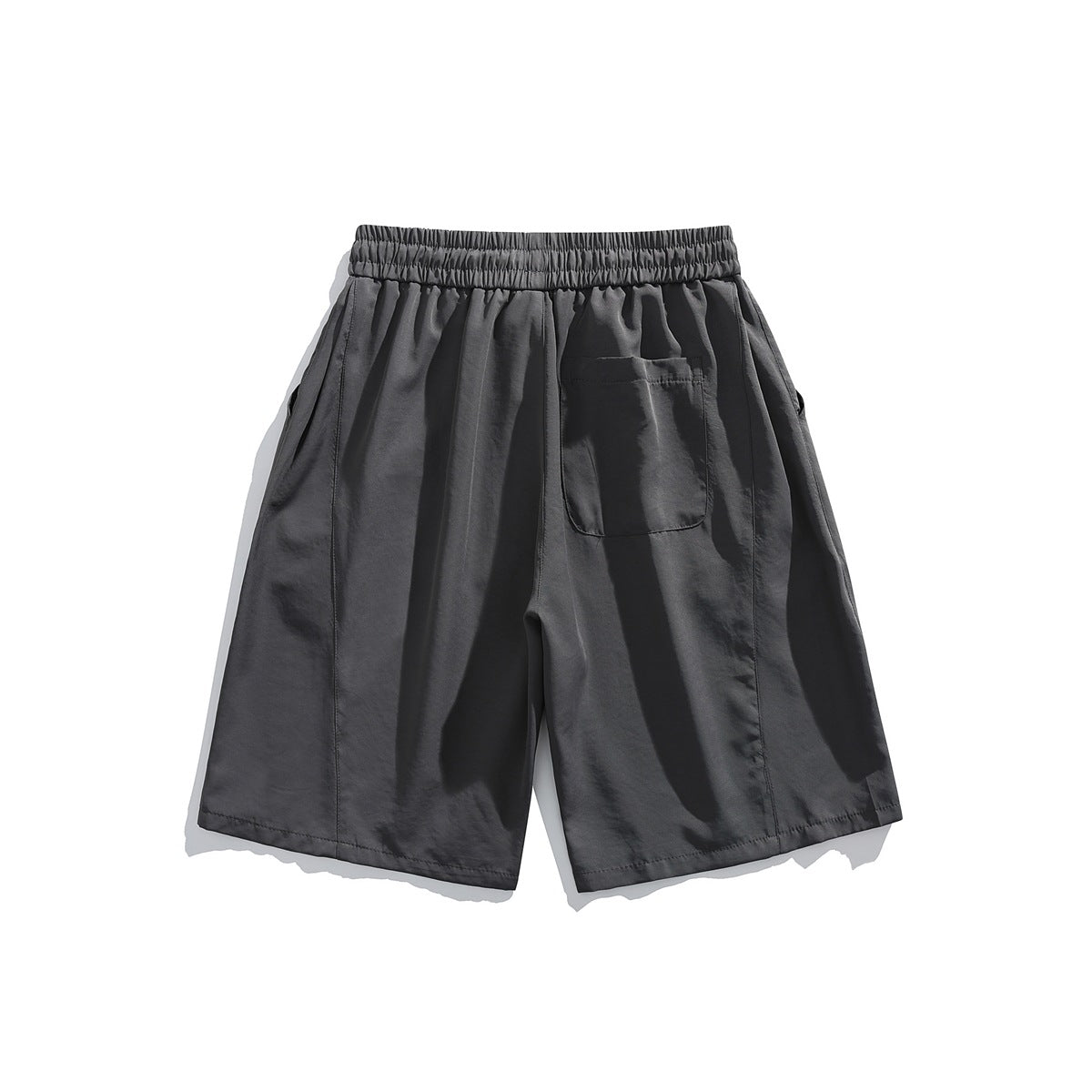 Back view of charcoal gray shorts with an elastic waistband and a single rear patch pocket.