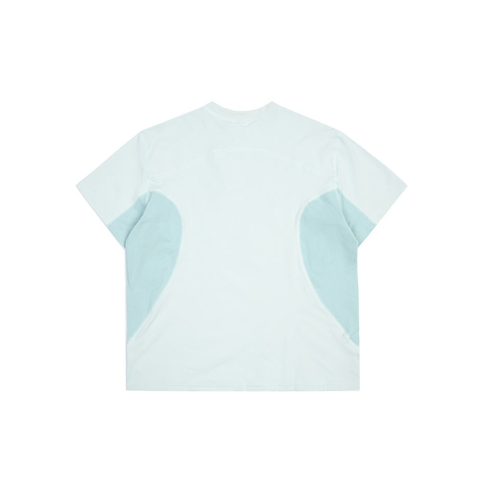 Back view of a pale mint short-sleeve shirt with light blue-green curved side panels.