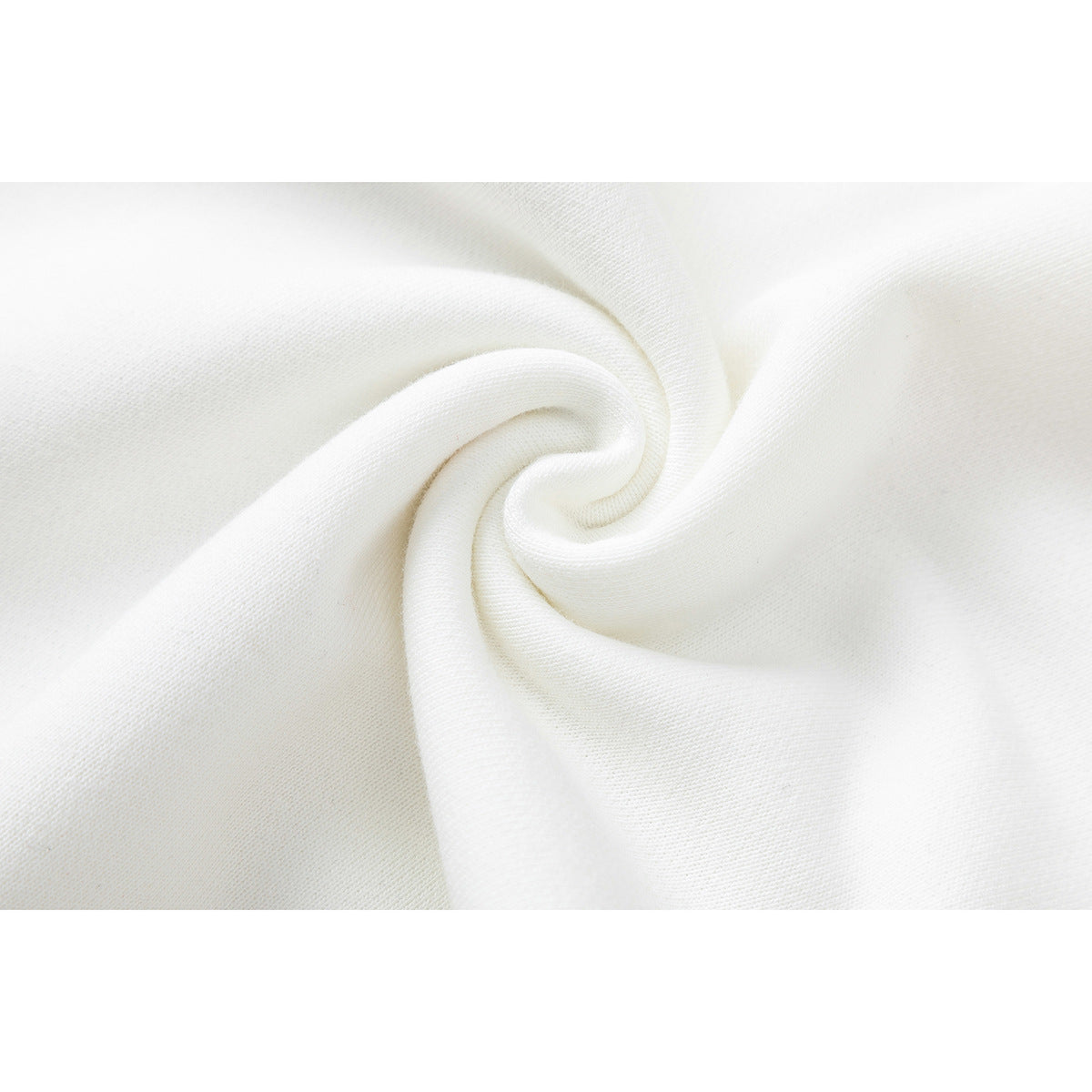 Close-up of white sweatshirt fabric gathered into a spiral fold.