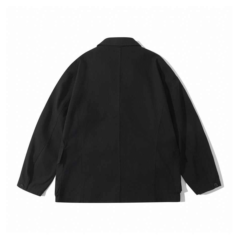 Back view of a black relaxed blazer-style jacket with center back seam and button cuff tabs