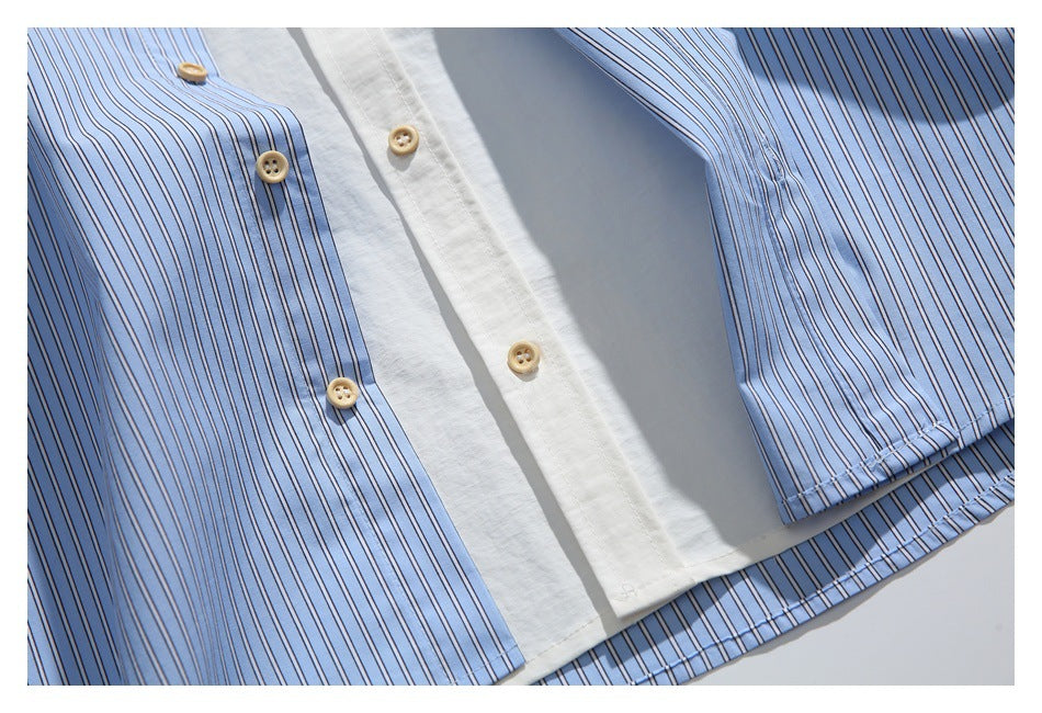 Close-up of the shirt's white button placket, tan buttons, striped panels, and lower hem.