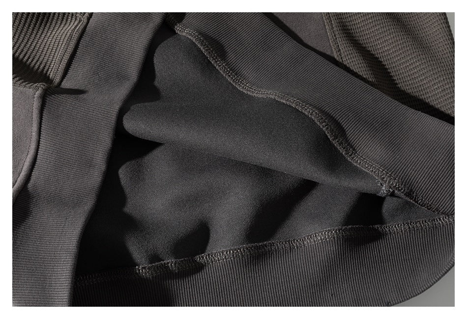 Close-up of the sweatshirt's interior, showing the ribbed hem and overlocked seams.