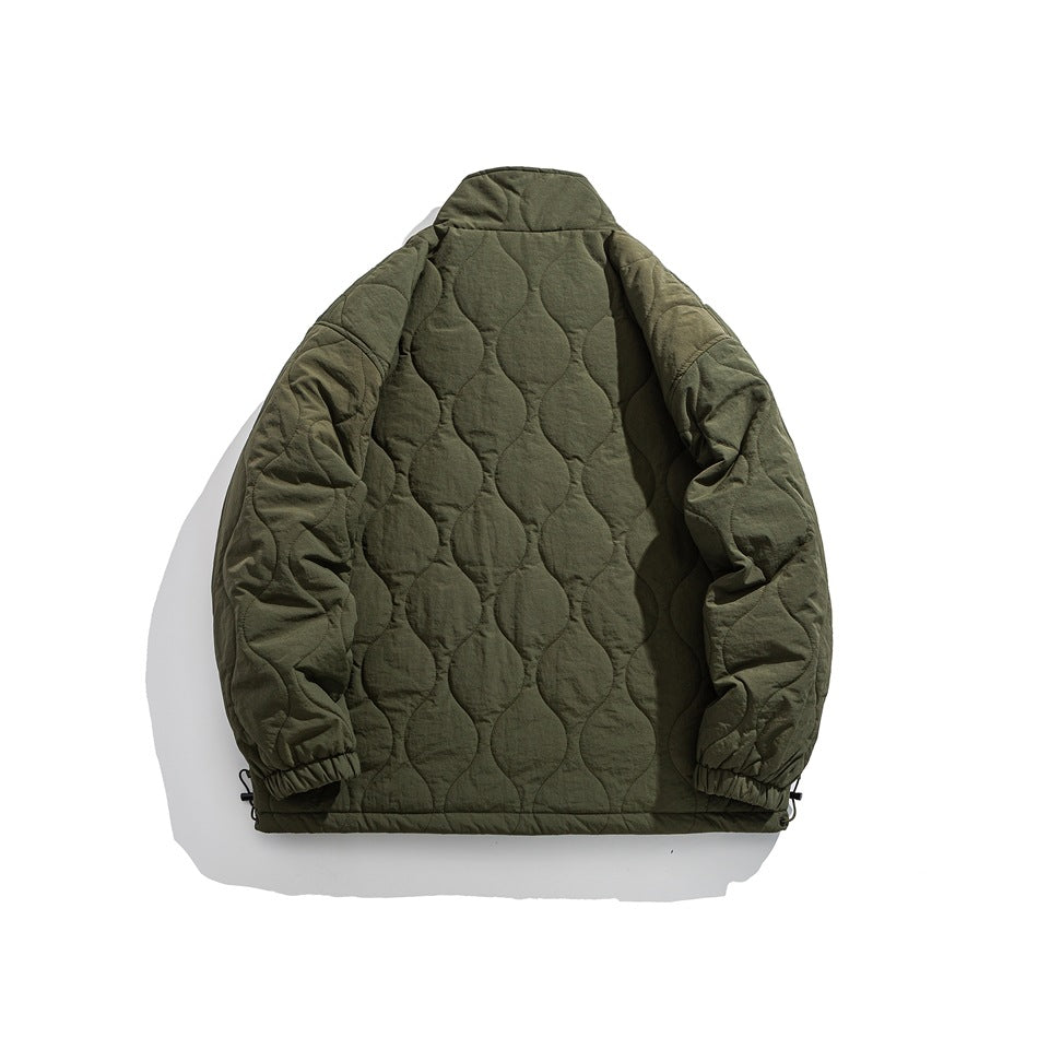 Back view of a dark olive quilted jacket with a high collar and elastic cuffs.