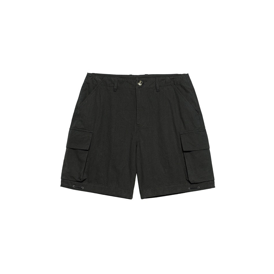 Black cargo shorts flat lay, front view, with button waist, belt loops and large flap pockets on each side