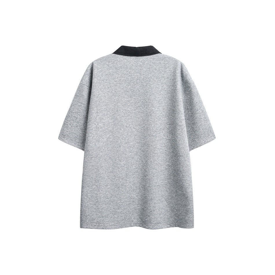 Back view of a heather gray short-sleeve polo shirt with a dark collar, laid flat on white.