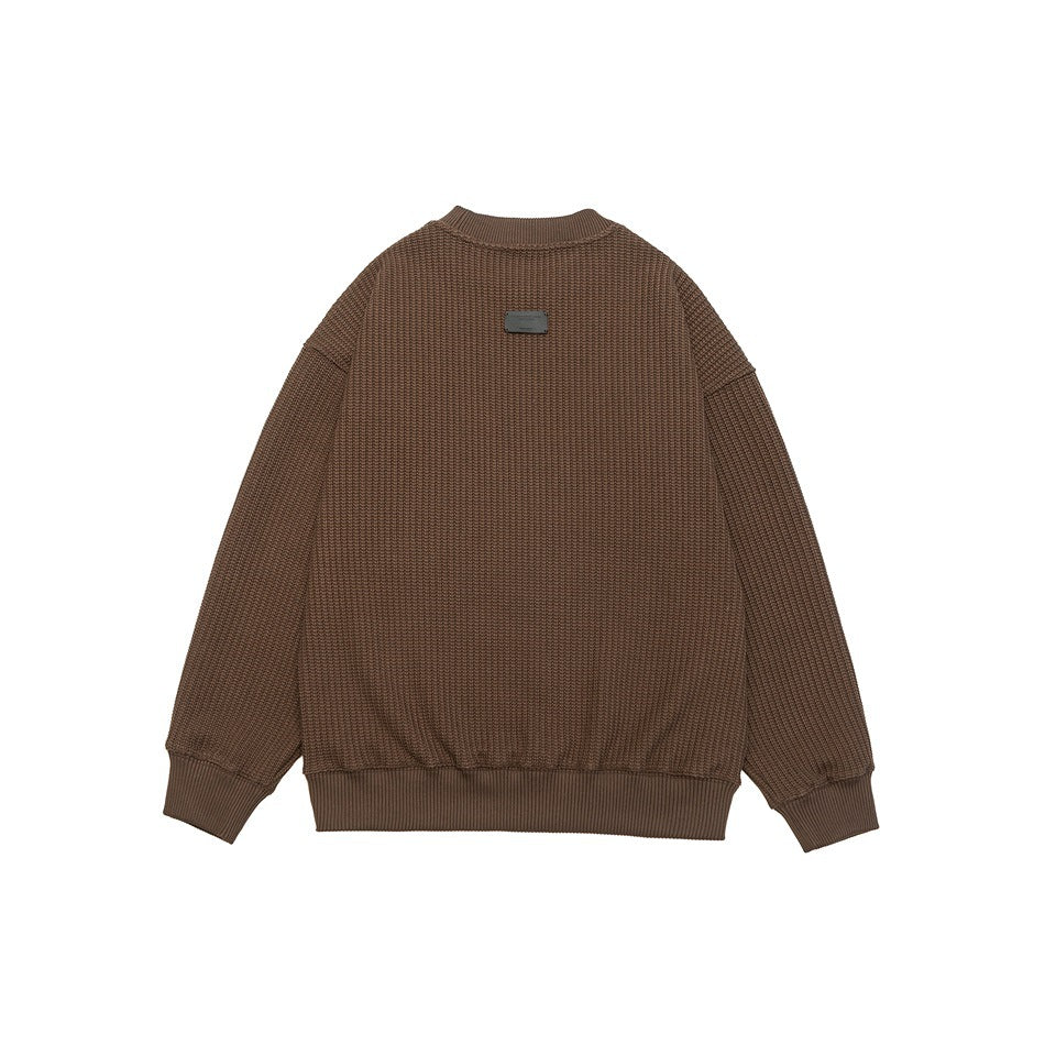 Back view of a brown textured knit sweater with ribbed collar, cuffs, and hem on a white background.