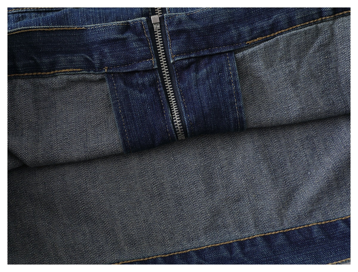 Close-up of the jacket's inside denim and zipper, showing the lighter reverse weave and stitched seams.