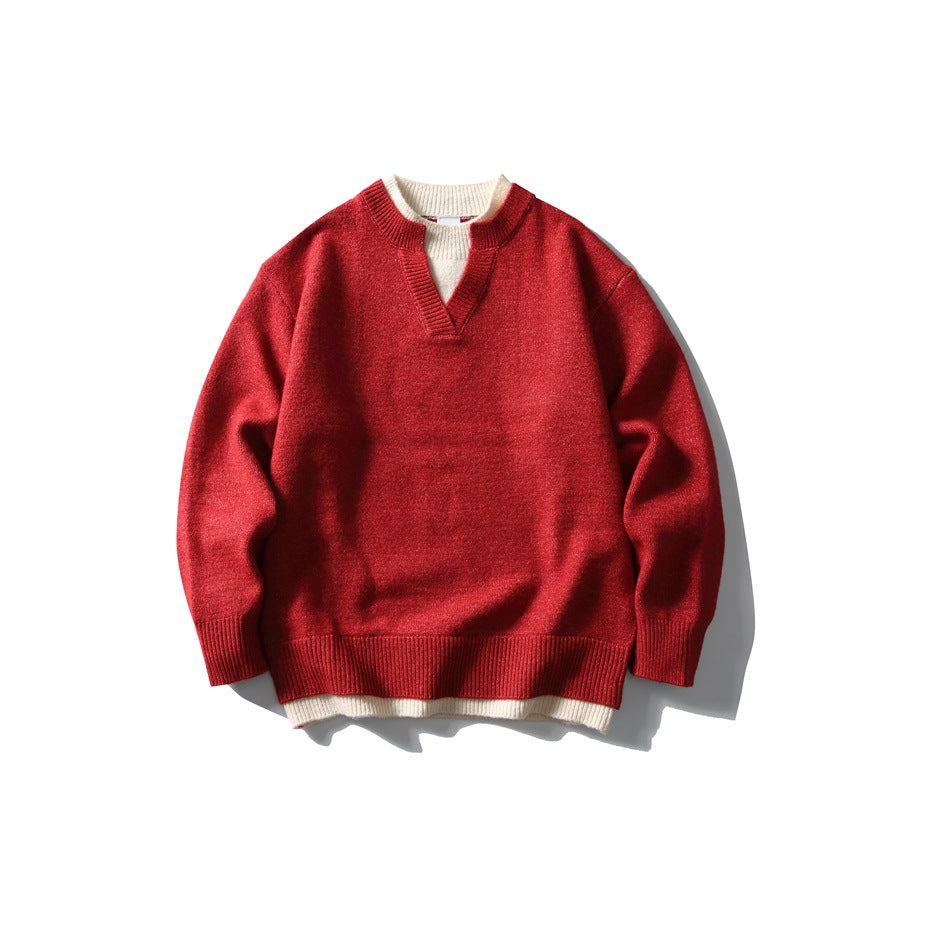 Red knit pullover sweater with notched V-neck and cream layered collar and hem, flat lay front view