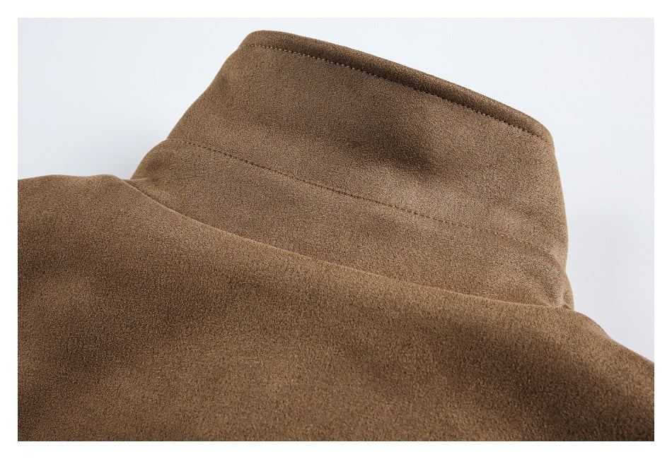 Close-up of the brown jacket's raised collar and stitched seams.