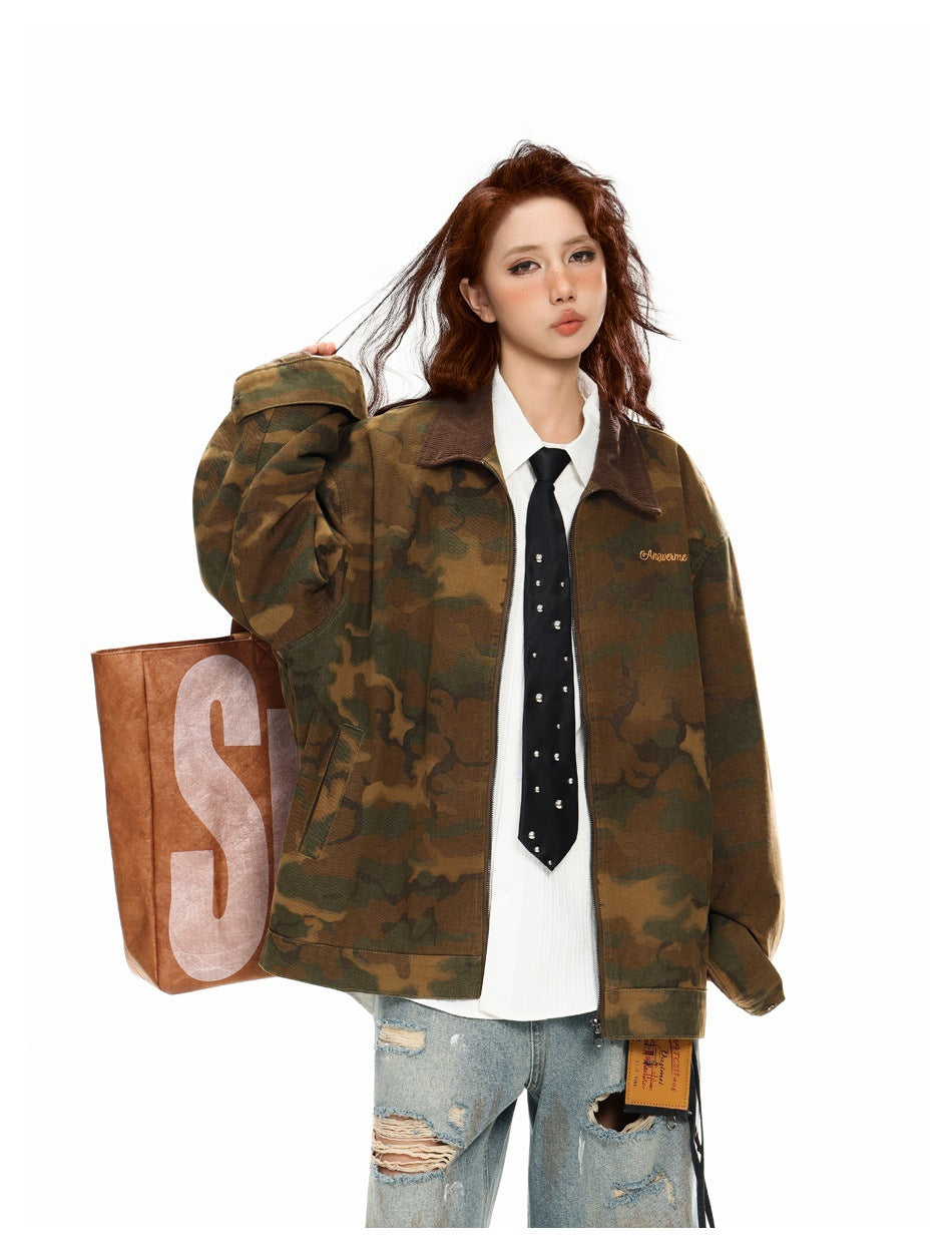 Close view of model in loose camouflage jacket with brown corduroy-look collar, white shirt and black studded tie