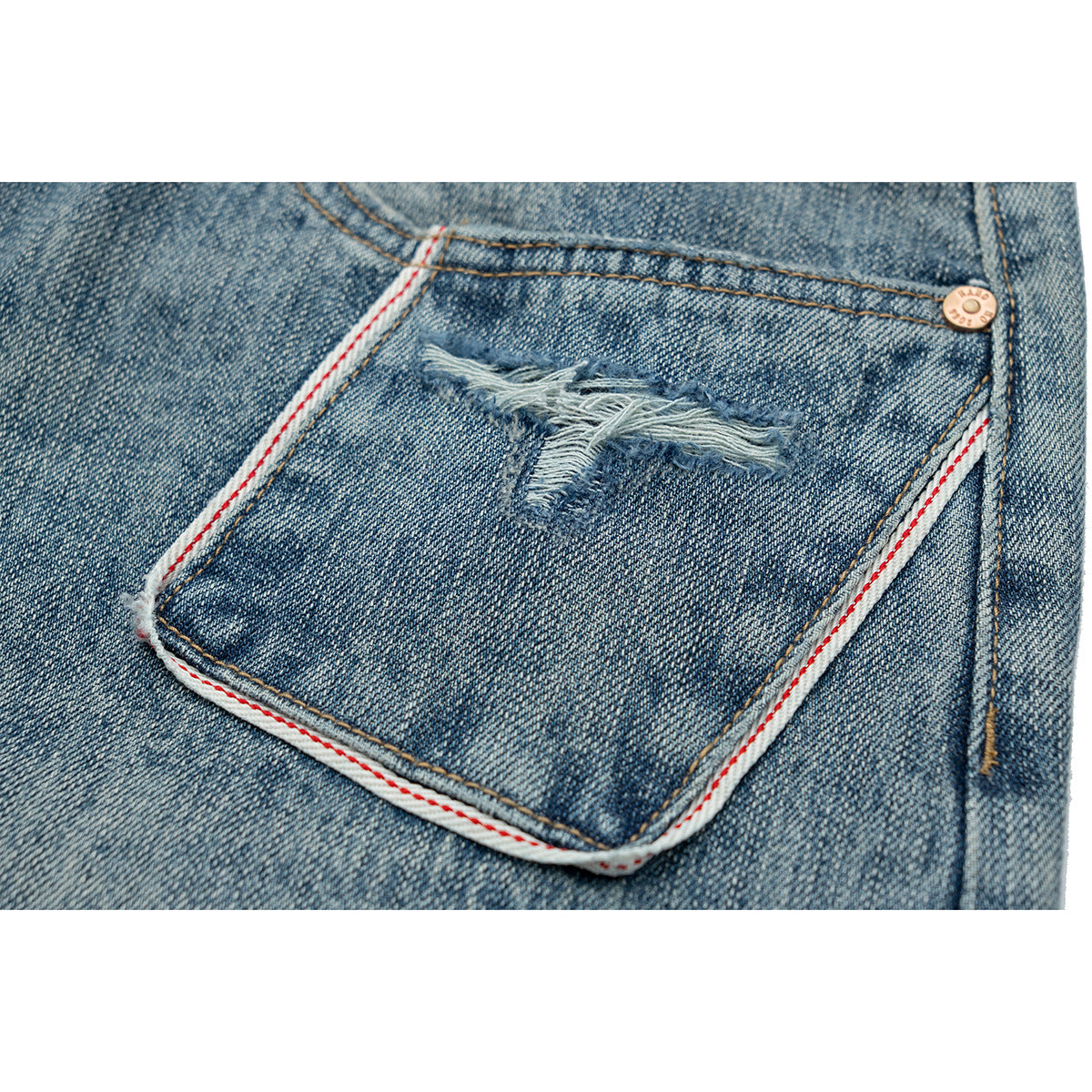 Close-up of a distressed blue denim pocket with red-and-white trim and a copper rivet.