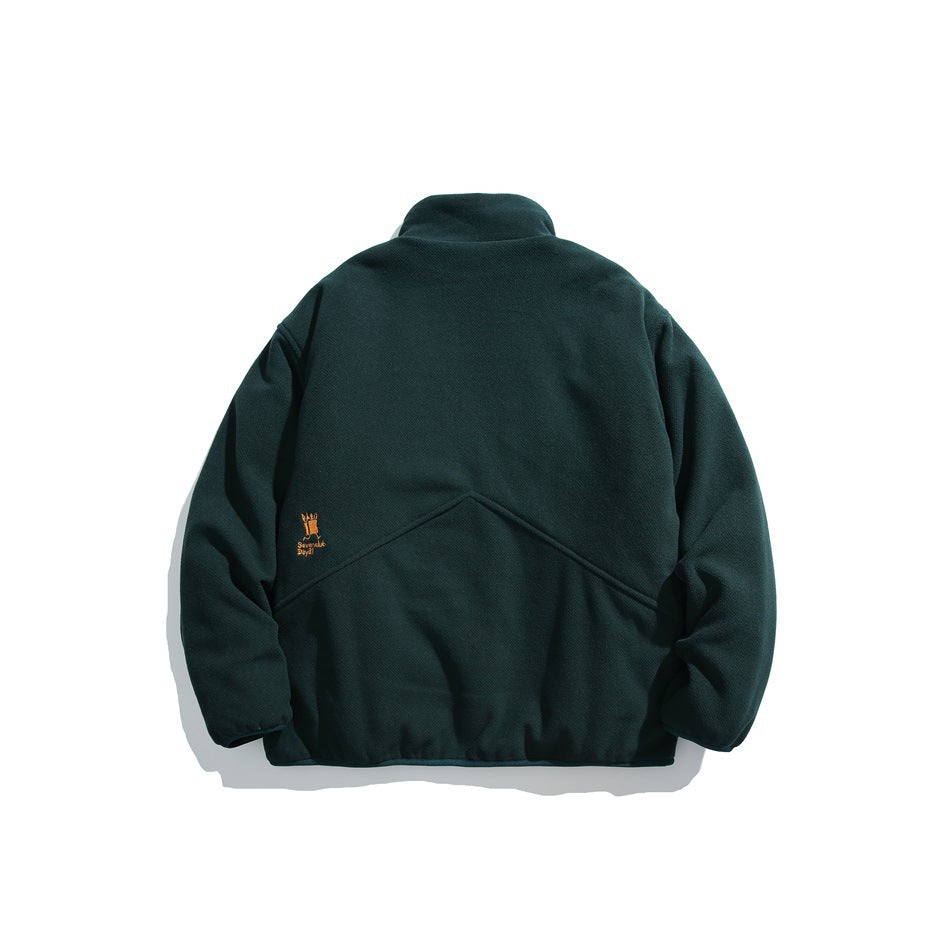 Back view of a dark green pullover with a raised collar, curved seam detail, and small embroidered mark.