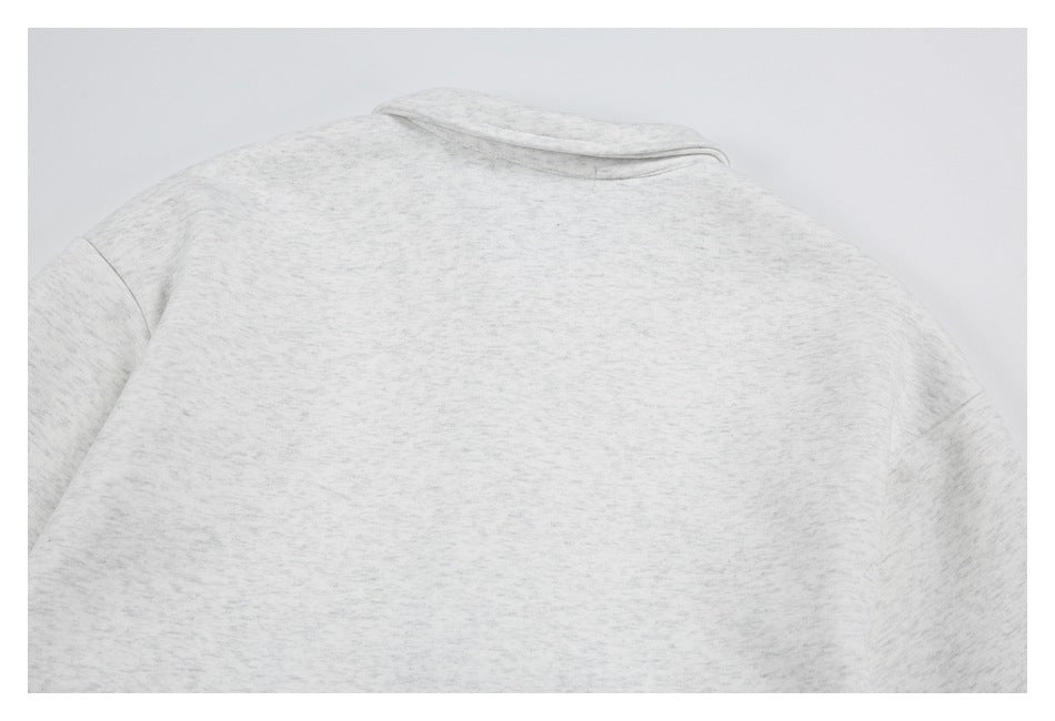 Back view of a light gray heathered collared garment, shown flat against a plain background.