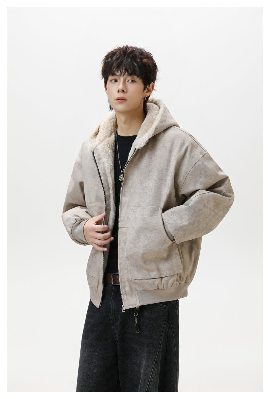 Model wearing a taupe hooded zip jacket with cream plush lining, oversized sleeves, and large front pockets.